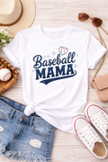 White t-shirt with 'Baseball Mama' text on a wooden surface with accessories.